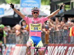 The Overall leader, Spanish rider Alberto Contador of the Tinkoff-Saxo team gestures as he crosses the finish line of the 21st and last stage of the 98th Giro d'Italia cycling tour over178 km from Torino to Milan, 31 May 2015. ANSA/DANIEL DAL  ZENNARO